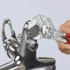 Knipex Pliers Wrench gripping a faucet fitting with smooth parallel jaws that prevent damage to chrome-plated plumbing fixtures.