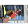 Electrician using the Wiha 28393 Insulated SlimLine Pop-Up Ultra Driver with integrated insulated blades for electrical panel installation and maintenance.