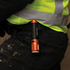 Klein Tools 56412 rechargeable LED flashlight clipped to a work vest pocket for convenient everyday carry.