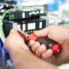 Technician using the Wiha 30277 SoftFinish Phillips and Slotted Screwdriver Set for electrical and industrial maintenance applications.