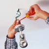 Wiha 32097 insulated screwdriver used for electrical wiring and terminal block connections during electrical installation work.