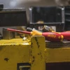 Wiha 33580 SoftFinish insulated slotted and Phillips screwdriver set used by an electrician for professional electrical installation and maintenance.