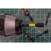 Wiha 70489 5/16-inch magnetic nut setter installed in an impact driver for driving hex head screws and fasteners.