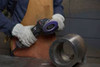 3M Cubitron 3 1169F flap disc grinding and blending curved metal surfaces with an angle grinder for weld removal and surface finishing.