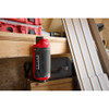 Milwaukee 2955-20 M12 Bluetooth Jobsite Speaker with PACKOUT Compatibility positioned on a construction jobsite workbench.