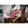 Contractor using Milwaukee 2930-21HD rear handle circular saw for framing and dimensional lumber cutting during construction.