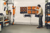 Professional STIHL battery charging station featuring multiple AL 301-4 chargers and AP batteries organized for fleet equipment management.