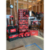 Milwaukee PACKOUT compact organizers stacked with PACKOUT storage system and tools on construction jobsite.