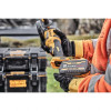 Close-up of FLEXVOLT battery installation on DeWalt DCG418X1 cordless grinder.