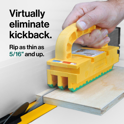 A woodworker using the GRR-RIPPER 2GO to perform a 5/16-inch thin rip cut on a table saw, showing the blade passing safely through the fixed leg tunnel.