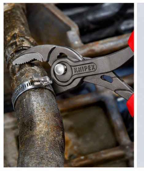 Knipex 8202200 TwinGrip Slip Joint Pliers removing a seized bolt from an engine block for automotive repair.