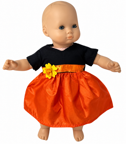Front view Happy Halloween dress for 15-inch baby dolls featuring a black short-sleeve bodice, shiny orange satin gathered skirt, coordinating orange waistband, and bright yellow flower accent. Halloween-themed Pinterest pin with pumpkins, bats, and autumn leaves. Shop Doll Clothes Superstore!