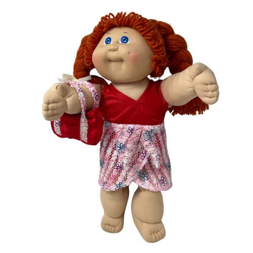 Front view alt text please
Adorable 15–16 inch Cabbage Patch Kid doll wearing a red stretch bathing suit with a colorful floral print cover-up skirt and matching red beach bag. Cheerful Pinterest pin features a tropical beach scene with ocean waves, hibiscus flowers, seashells, and summer accessories. Shop Doll Clothes Superstore!