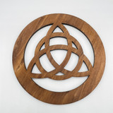 Round basswood knotwork disc shown from above on a white background, featuring interwoven geometric cutout