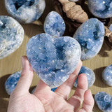 Natural blue celestite crystal heart geode close-up with druzy crystals