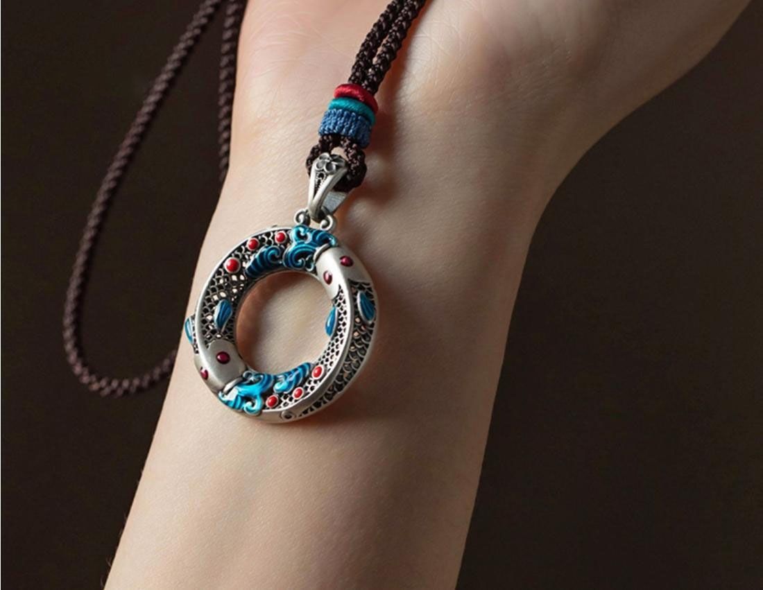 Artisan-inspired hollow carved copper enamel pendant