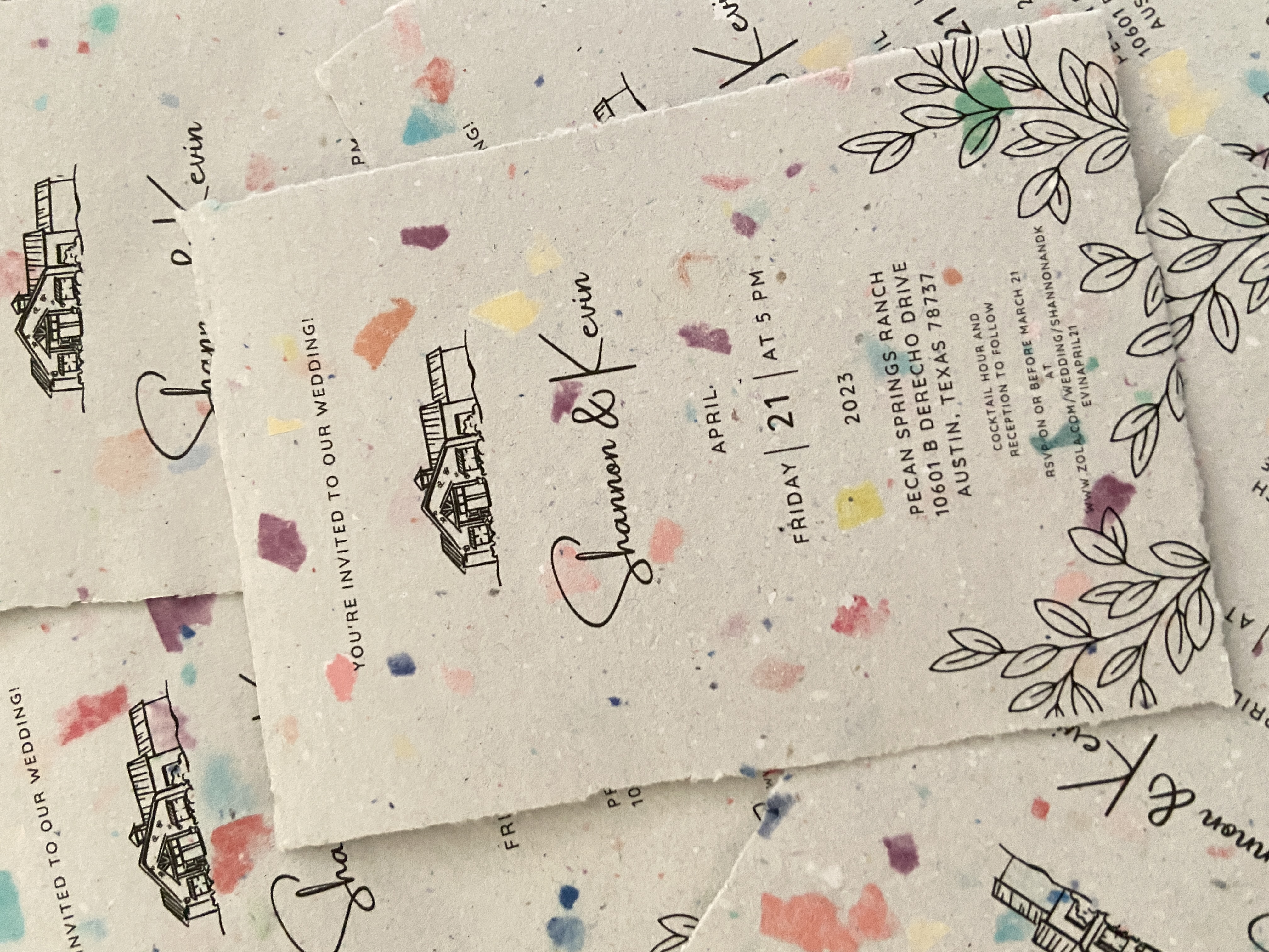 Multi-colored wedding invitation made by hand from recycled paper