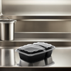 Take-Out Container Base & Lid Combo With Dome Lid 28 OZ 2 Compartment Plastic Black Clear Rectangle 150/Case