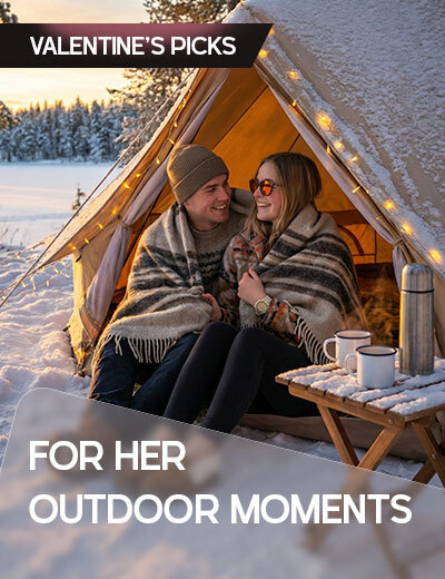 Graphic, winter campsite scene with a couple sharing hot drinks inside a lit tent, text, Valentine’s Picks For Her Outdoor Moments