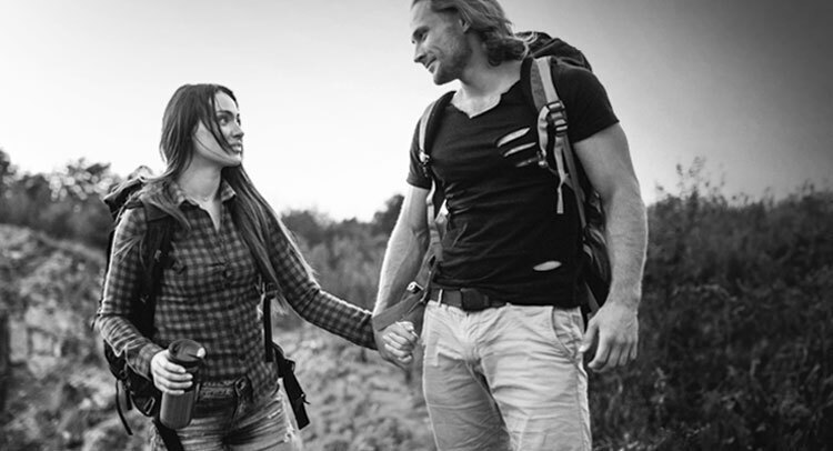 two campers holding hands