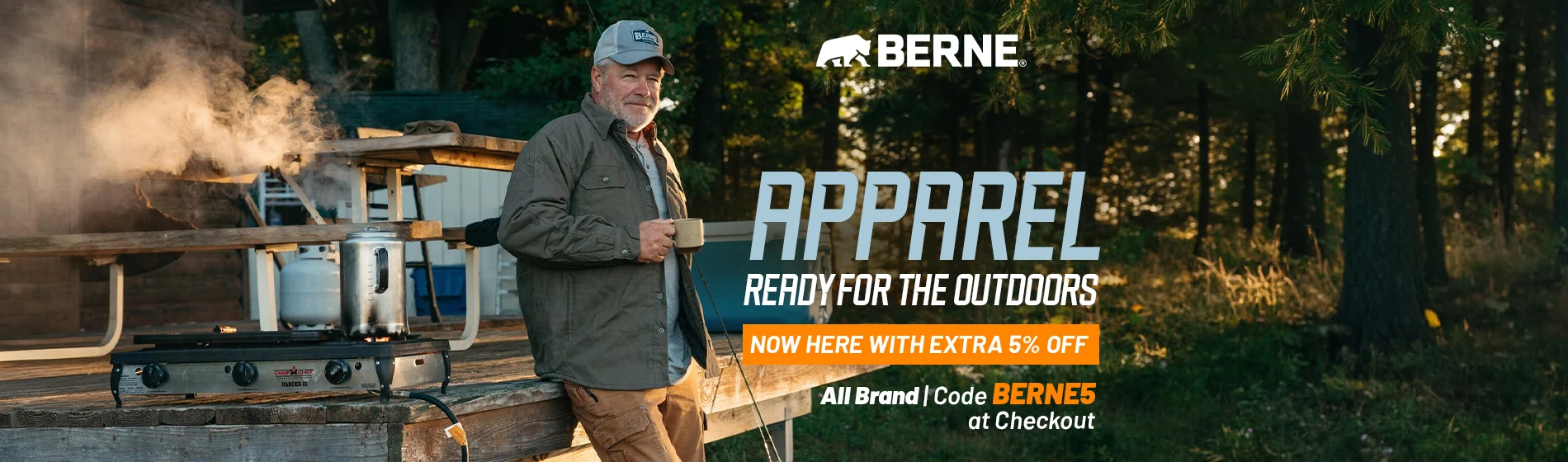 Graphic, a man wearing a cap and an olive green BERNE overshirt holding a mug, leaning against a wooden deck next to a steaming camp stove with a forest in the background, text,  BERNE APPAREL: 5% OFF ALL BRAND with code BERNE5 at checkout