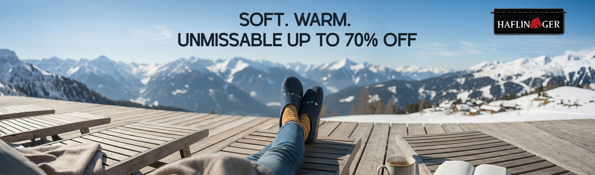 Graphic, person relaxing outdoors with feet up in blue HAFLINGER slippers and striped socks against snowy mountain view, text, HAFLINGER Slippers & Boiled Wool Clogs: SOFT. WARM. UNMISSABLE UP TO 70% OFF