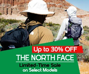 graphic, low angle view of a person with a backpack and trekking poles climbing up a rocky mountain slope against a clear blue sky, text, The North Face Limited-Time Sale: enjoy up to 30% off select models