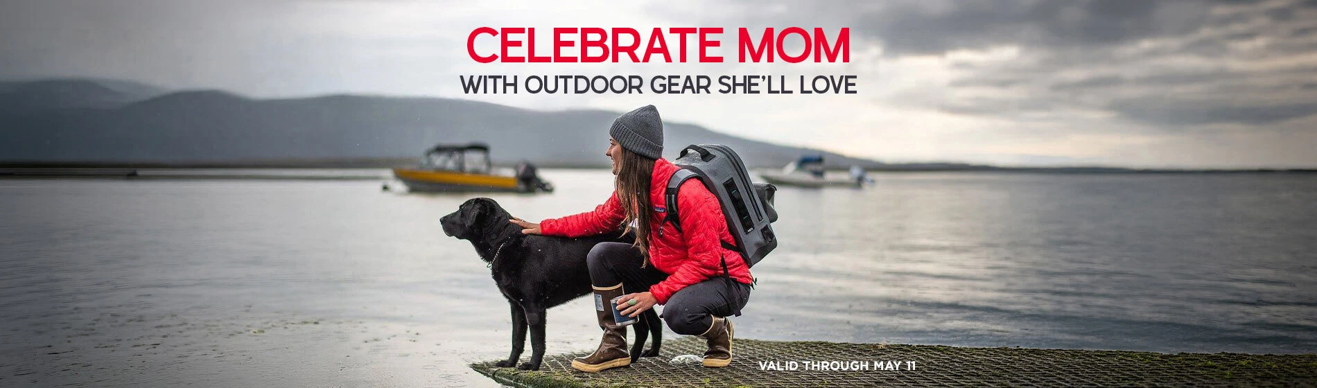 Graphic, woman hiker with backpack and dog at lakeshore with boats and mountains, text, Celebrate Mom with Outdoor Gear She’ll Love