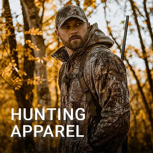 Graphic, a hunter wearing camo clothing in the woods