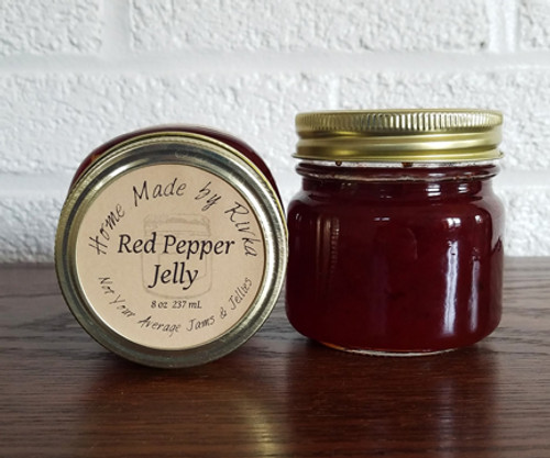 Our Red Pepper Jelly is a spicy pepper jelly that grows in spice the more you eat. Traditionally paired with cream cheese and crackers; this spicy jelly is a Christmas favorite.