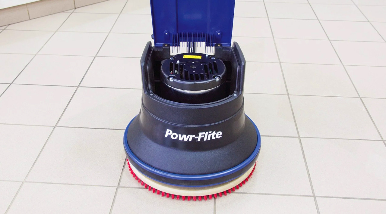 Industrial floor scrubber cleaning a commercial facility floor