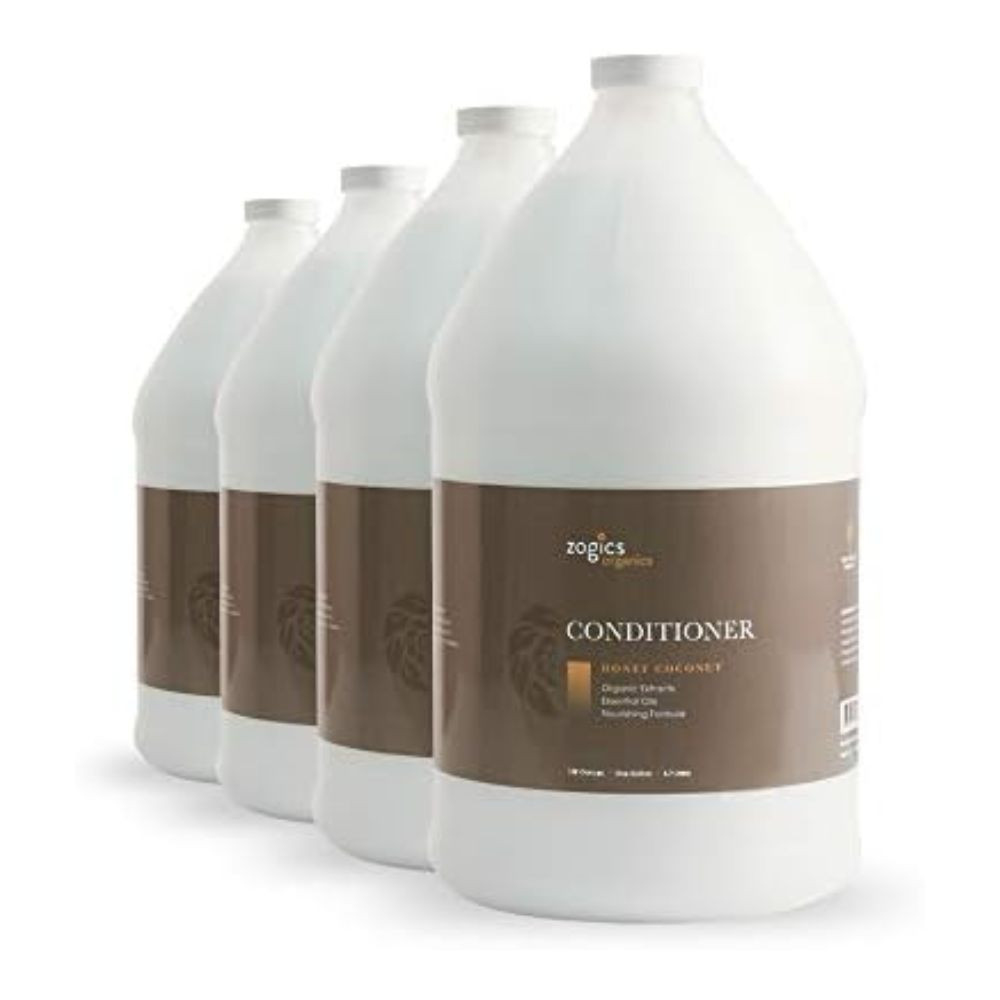 Bulk refill gallons of Zogics Organics Honey Coconut conditioner lined up
