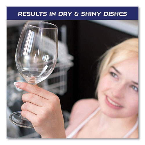 Woman holding a spotless wine glass after using Jet-Dry rinse aid in dishwasher.