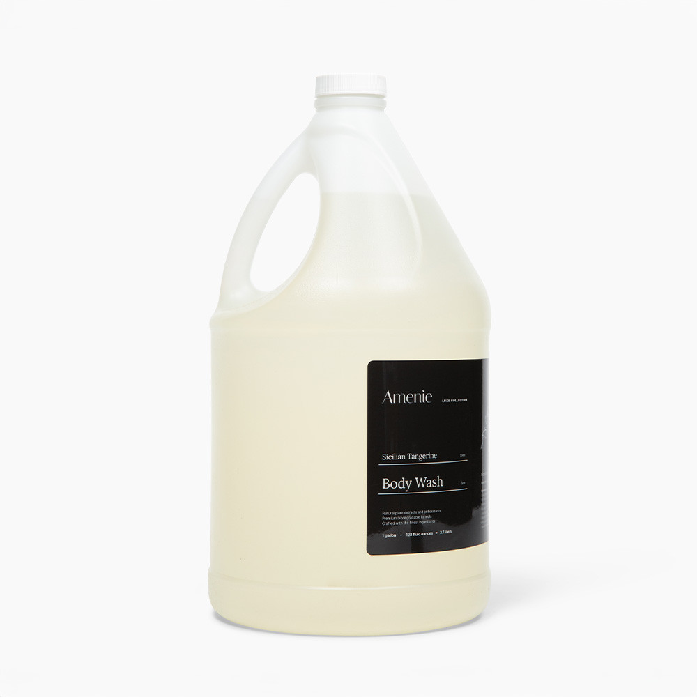 Amenie Sicilian Tangerine Body Wash in a gallon-size bottle with black label on white background
