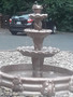 brown hand made stone fountain