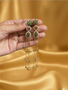 Long chain Kashmiri earrings with red green enamel and pearl detailing