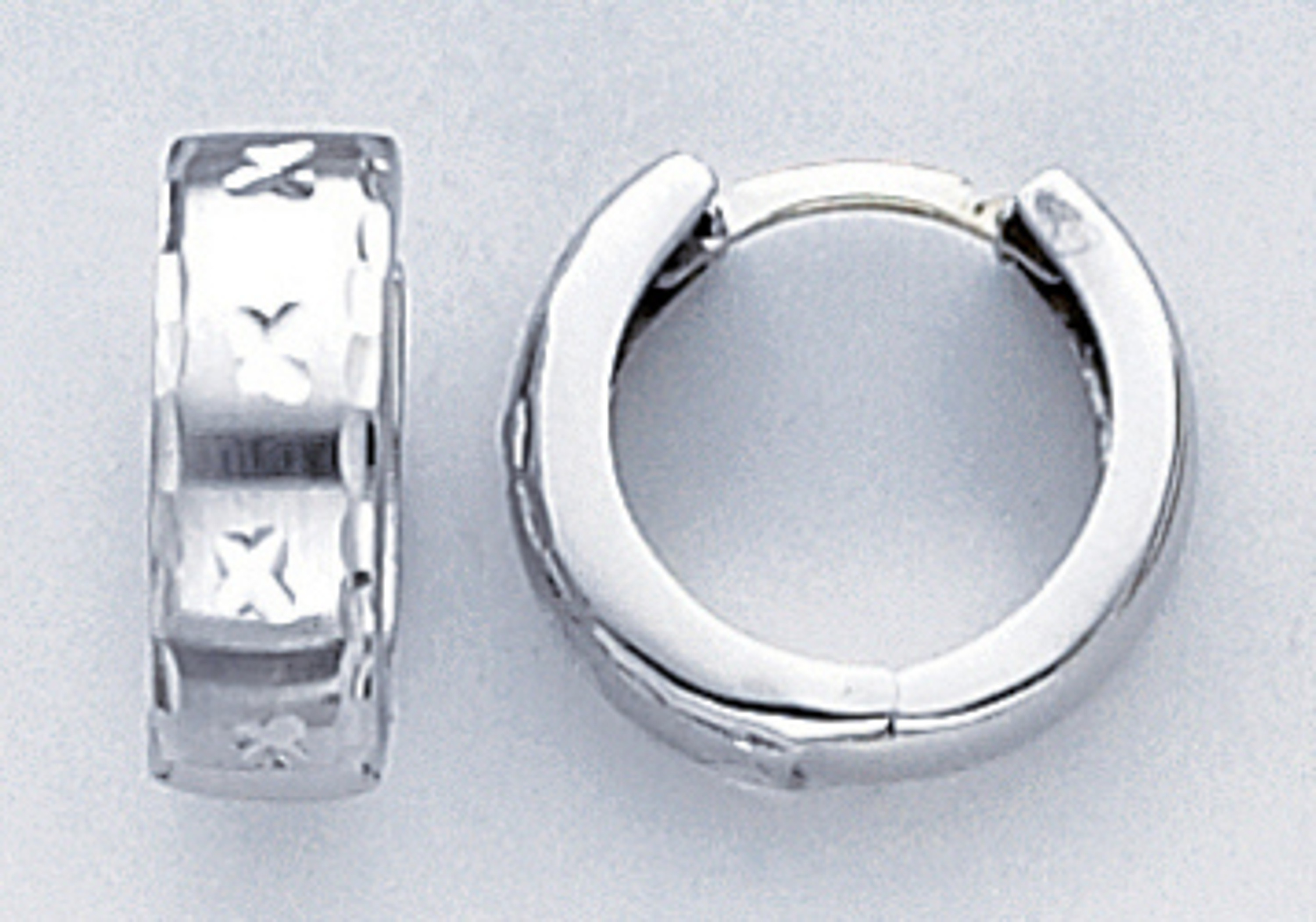 14k White Gold 15.1mm Huggies Earring. 14k White Gold 15.1mm Huggies Earring.
