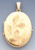 14k Gold  46.9mm Oval Shape Locket With Flower Engraveing