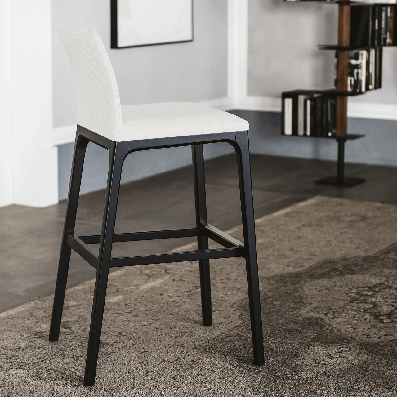 BIANCO - Cattelan Arcadia Couture Counter Stool, Bianco Soft Leather, Matt Black Stained Beech Frame, diamond tufted back, 3/4 view.