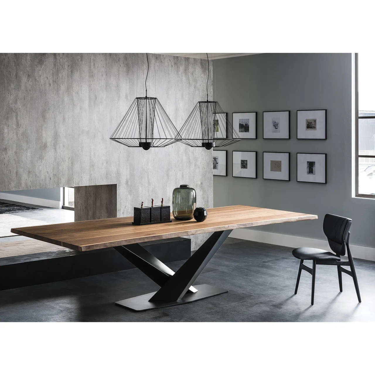 NERO SOFT LEATHER - Cattelan Dumbo Side Chair in Nero/Black Soft Leather with Black Stained Ashwood Frame in a modern dining room setting.