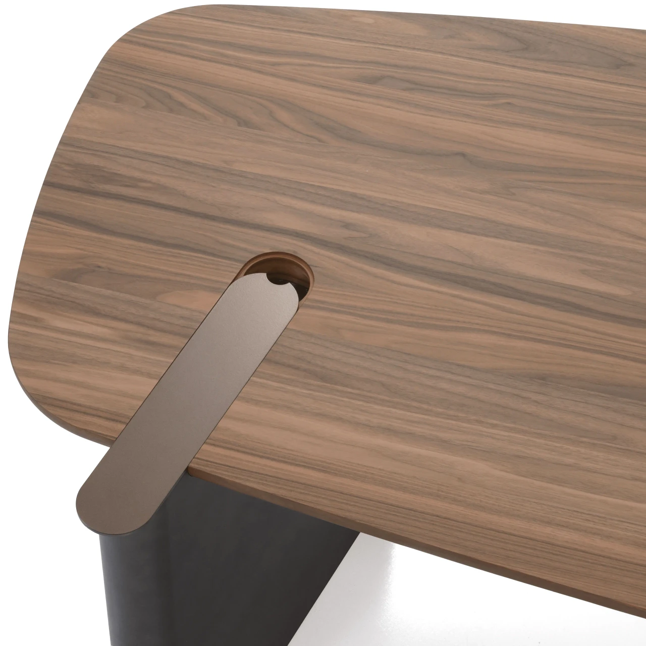 WALNUT || Closeup - Close-up angle of a modern walnut wood table top featuring a built-in cable management slot with a grey metal cover.