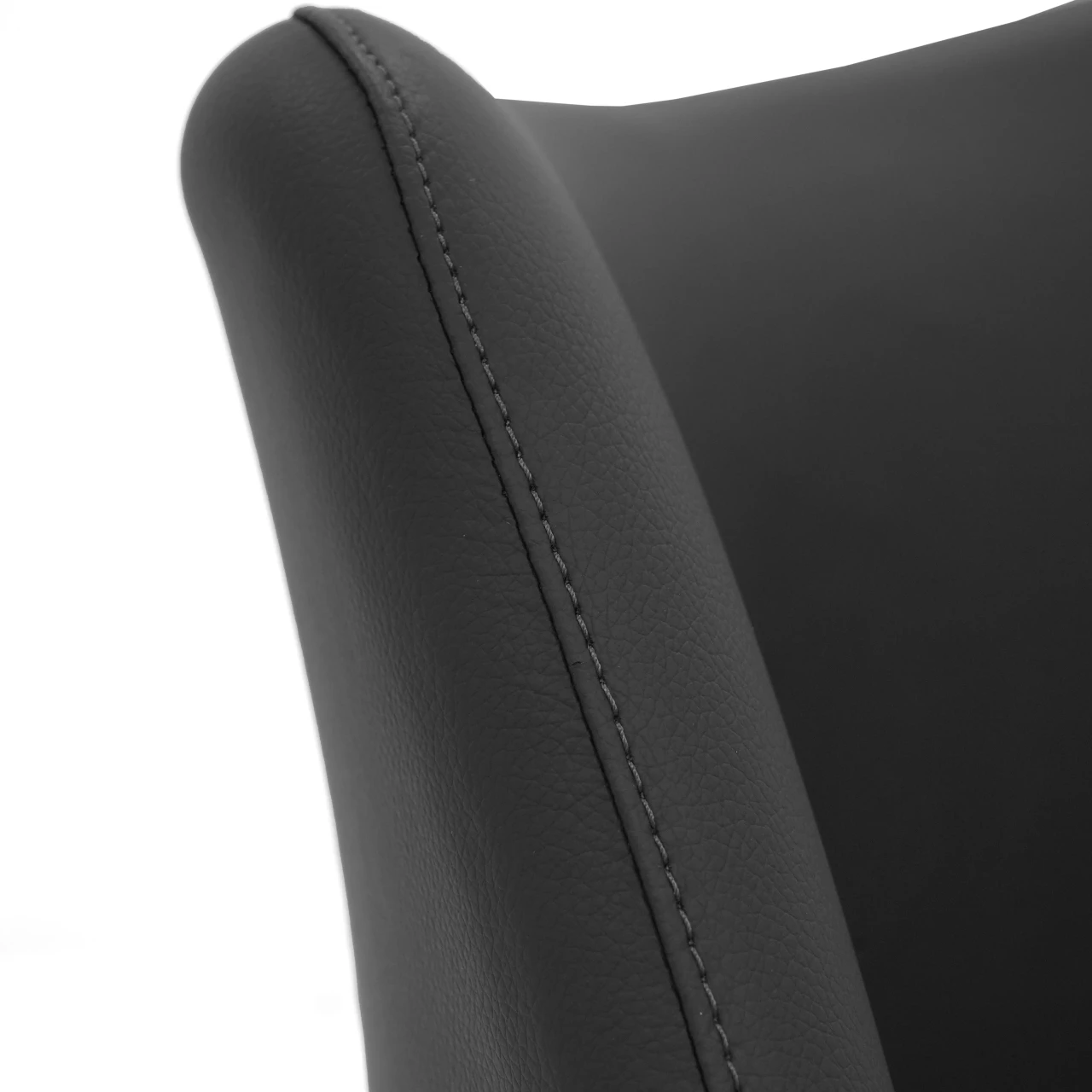 Closeup - Close-up angle of Malibu Bar Stool in black EcoPelle featuring detailed stitching on the curved backrest.