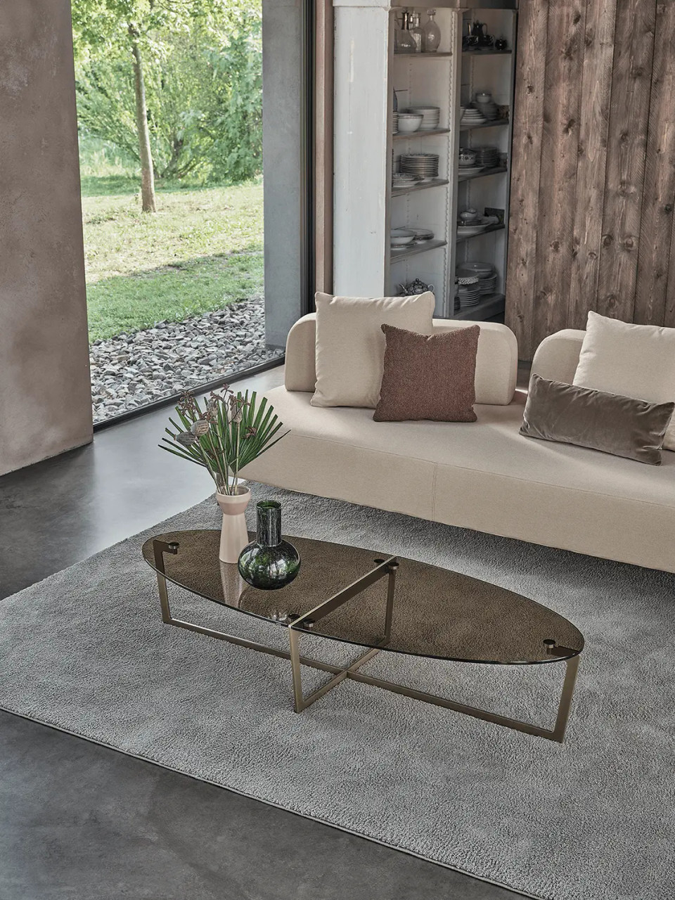 BRONZE GLASS/AGED BRASS - Cross Oval Cocktail Table Shown in Living Room Setting