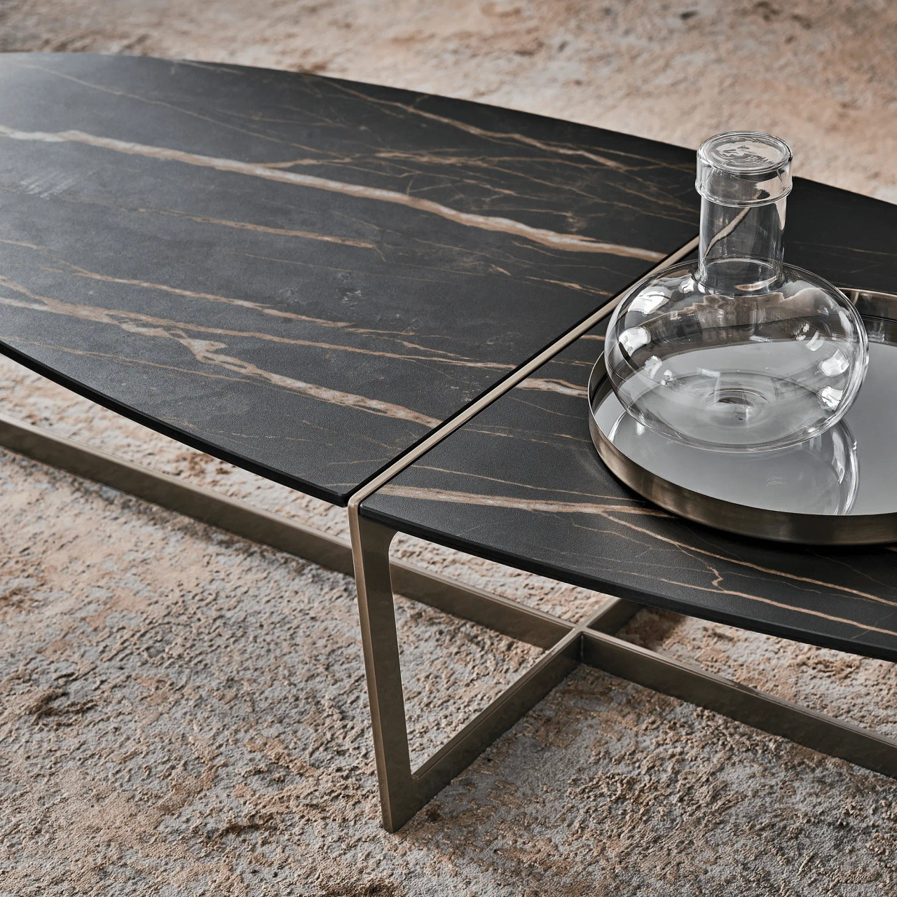 MATTE NOIR/AGED BRASS - Cross Oval Cocktail Table Shown in a Living Room