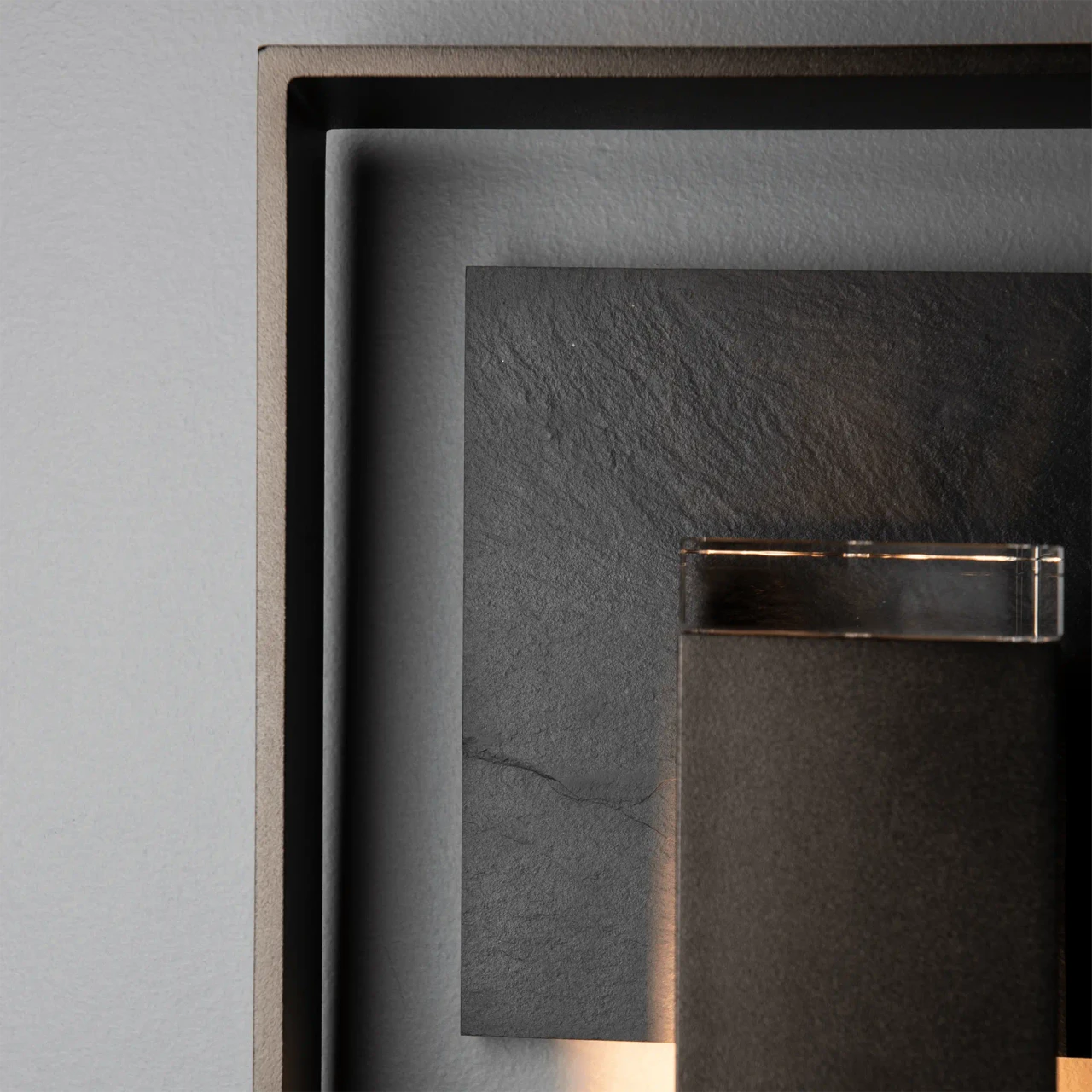 Closeup - Close-up of Shadow Box Slate Sconce in Oil Rubbed Bronze with clear glass and slate accent.