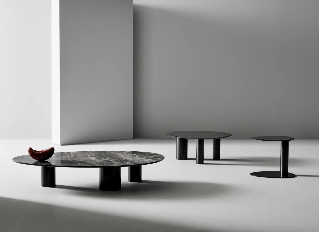 HIGH - Bonaldo Sasso Cocktail Tables, modern style, glossy grey glass tops, lead metal bases, living room, three-quarter view.