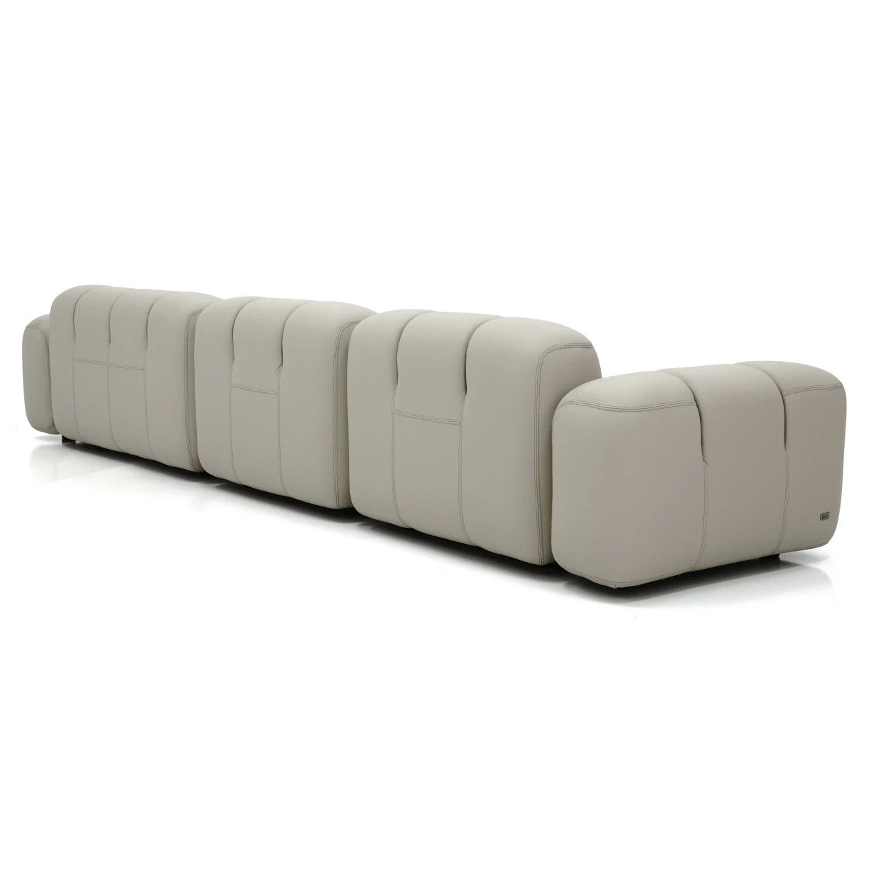 Gamma Arredamenti Moxy Small Sectional in Chalk Leather, E Piuma style with recessed legs, 3/4 angle view.