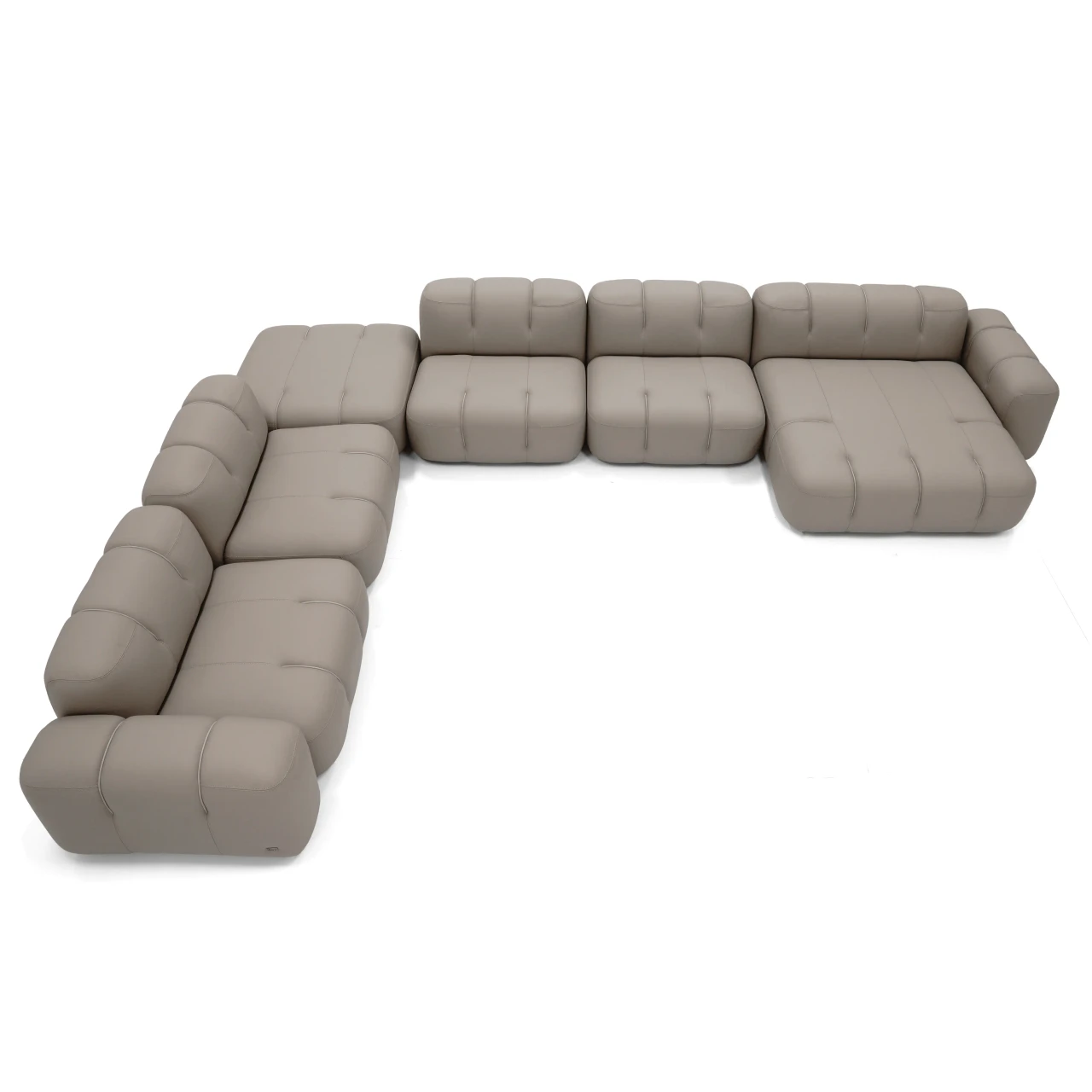 Gamma Arredamenti Moxy Sectional in Putty Leather, modern L-shaped design with recessed legs, high angle view.