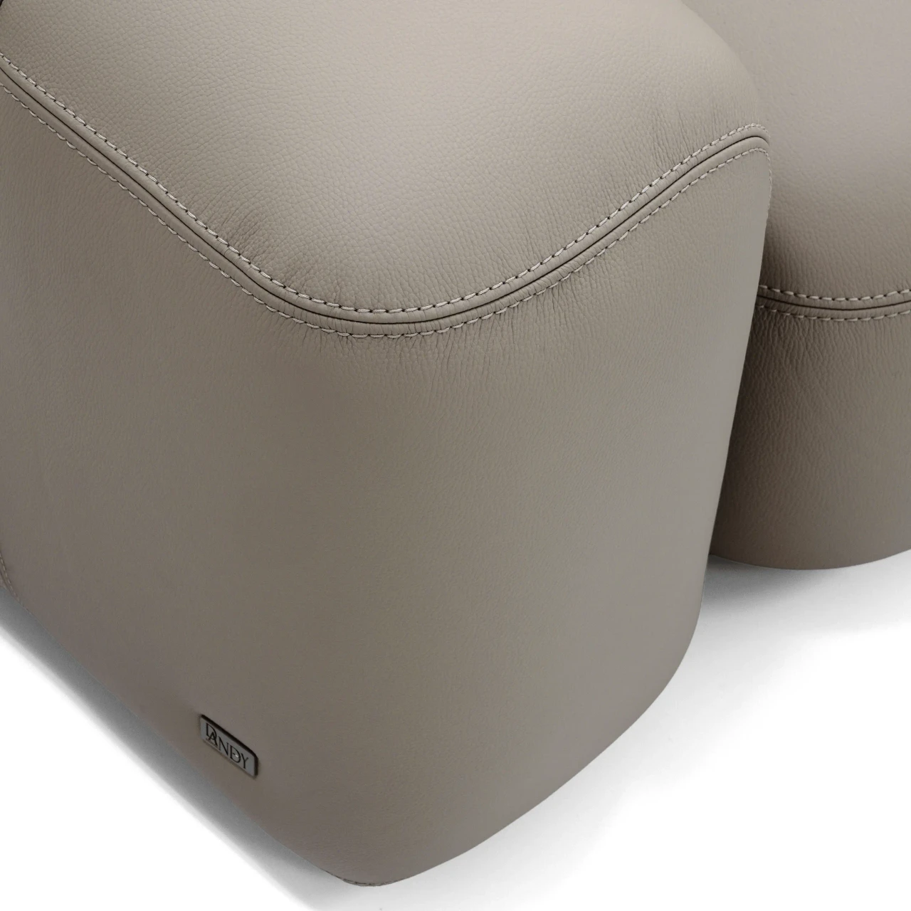 Closeup - Close-up angle of Gamma Arredamenti Moxy Sectional in Putty Leather with matching stitch and clay leather welt.
