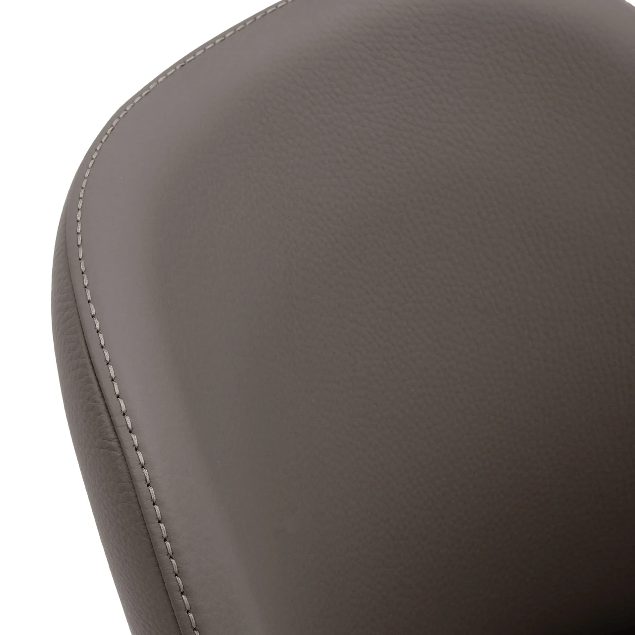 Closeup - Close-up angle of Gamma Arredamenti Medea Dining Chair in Truffle Leather with matching stitch detailing.
